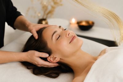 Woman receiving a relaxing head massage.