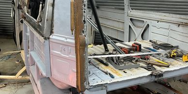 A VW bay window camper van being restored