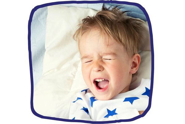 Toddler laying in bed struggling to sleep