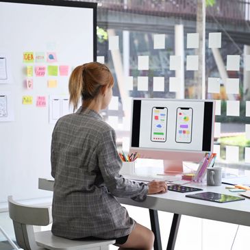 Woman at a computer designing a learning experience.