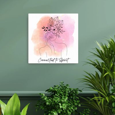 Artwork of a serene figure with crystals and flowers, captioned 'Connected to Spirit.'