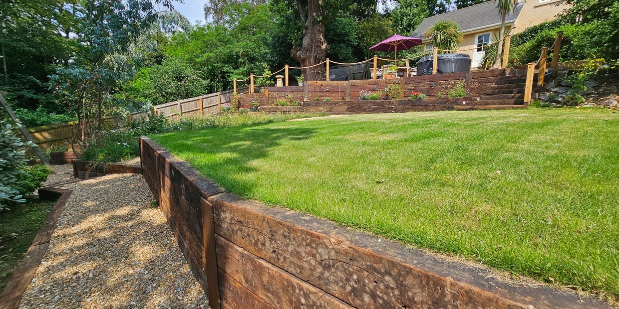 Railway sleepers with turf and stone paths. 