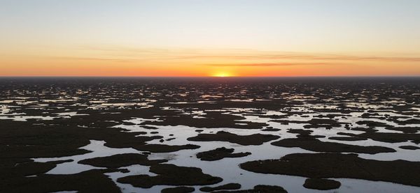 Drone shot of the sun setting over the Everglades. 