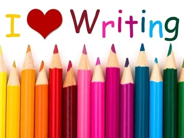 Colorful pencils and 'I love writing' text above them.