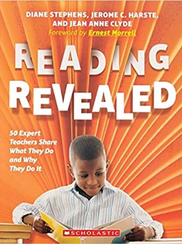 Book cover of "Reading Revealed" with a boy reading and orange radiating background.