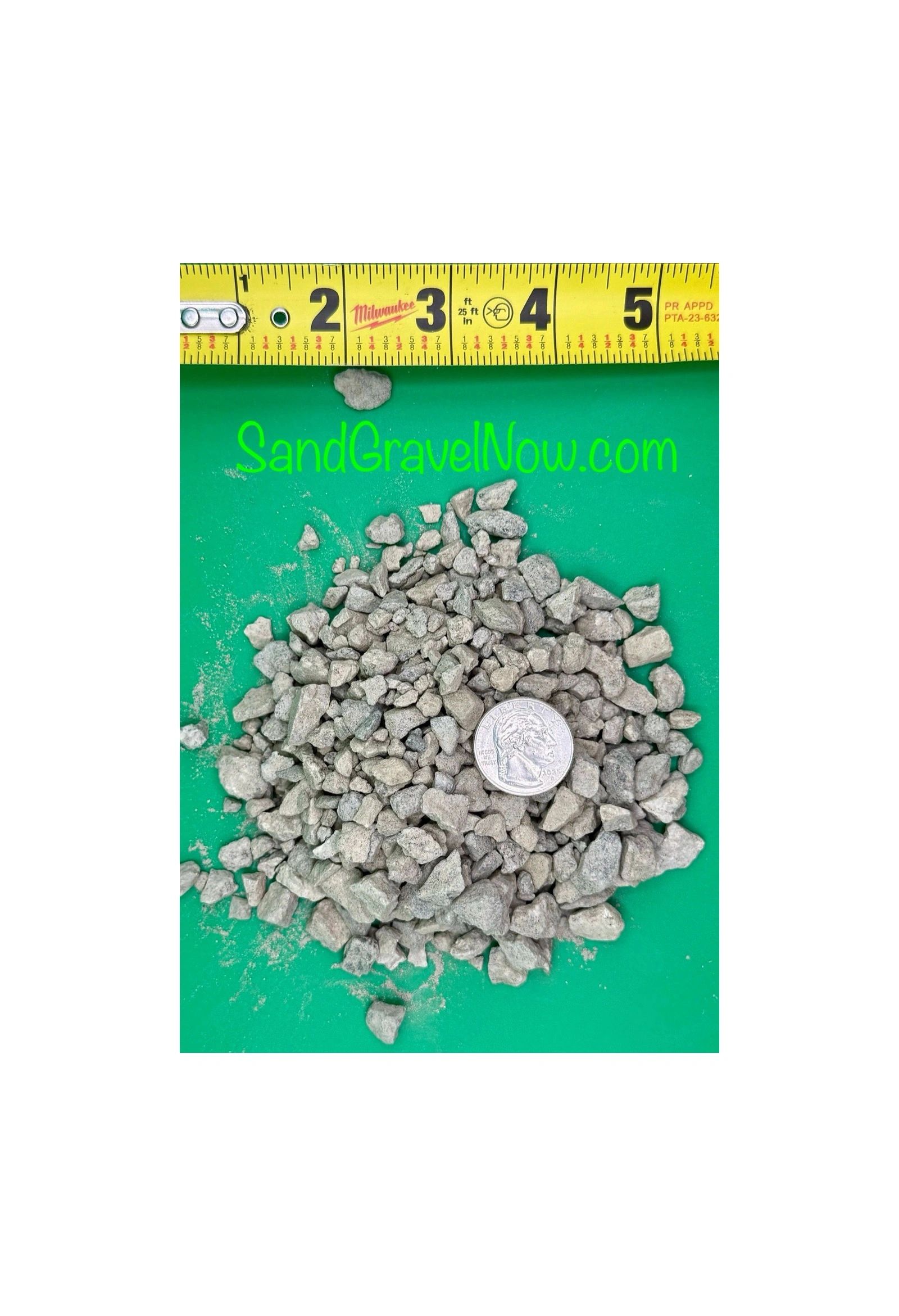 Small gravel pieces with quarter and ruler for size reference.
