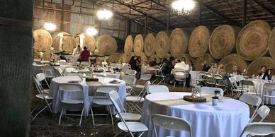 alt="seating for up to 300 guests in the rustic hay barn at Honey Lee Ranch"