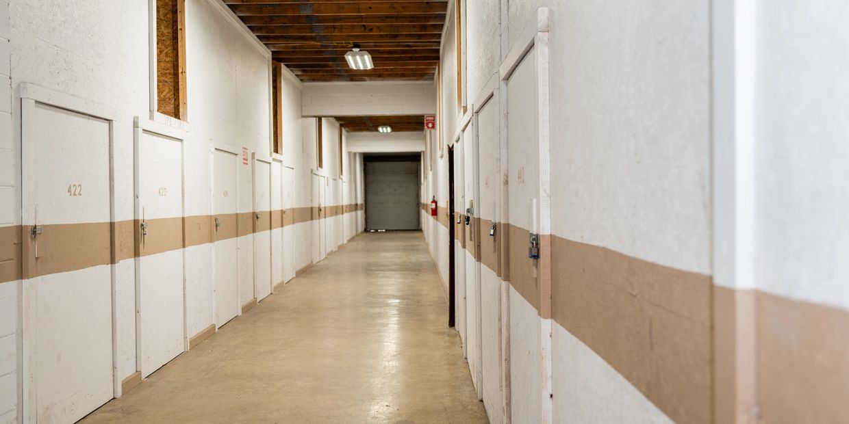 View of white and beige color doors and the corridor