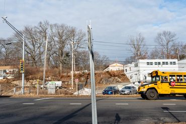 A yellow van running on the road 