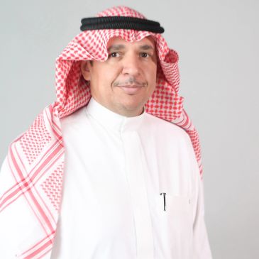 Middle-aged man in traditional Saudi attire with a neutral expression.