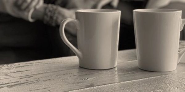 photo of two coffee cups