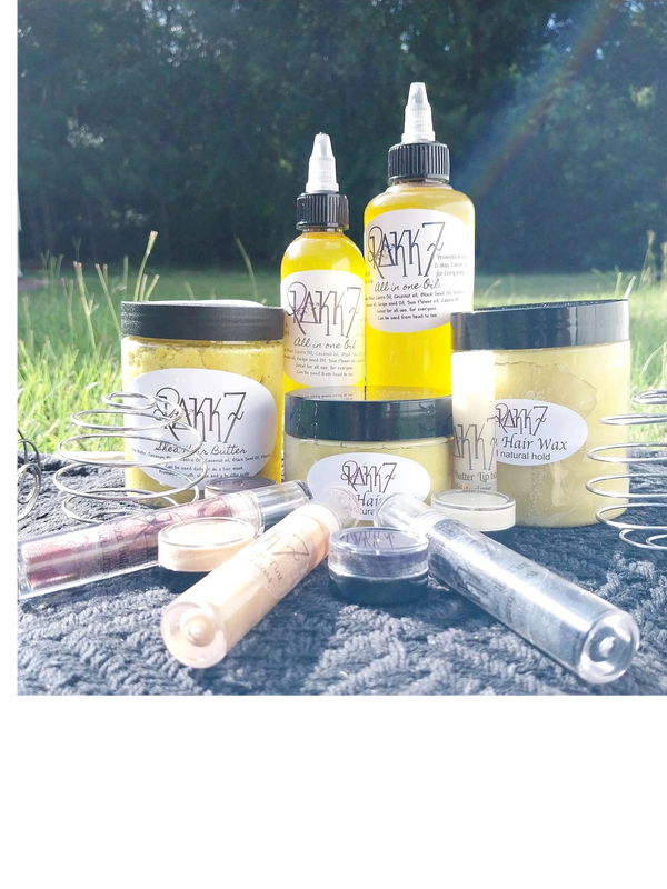 Natural skincare and hair care products displayed outdoors on a textured cloth.