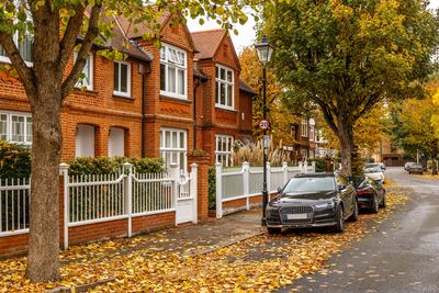 A residential area with cars parked outside houses  