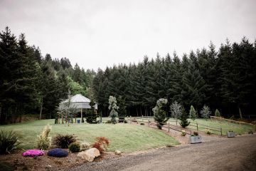 Scenic park area with trees and a gazebo.