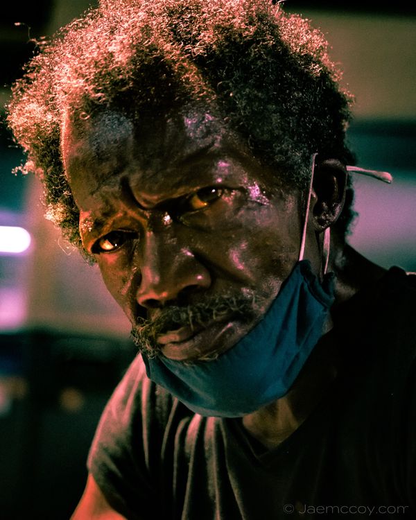 Street photography photo of a homeless man downtown Raleigh.