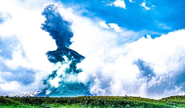 Mt. Cotopaxi one of the world's Highest Active Volcano erupts. My view from horseback summiting a ri