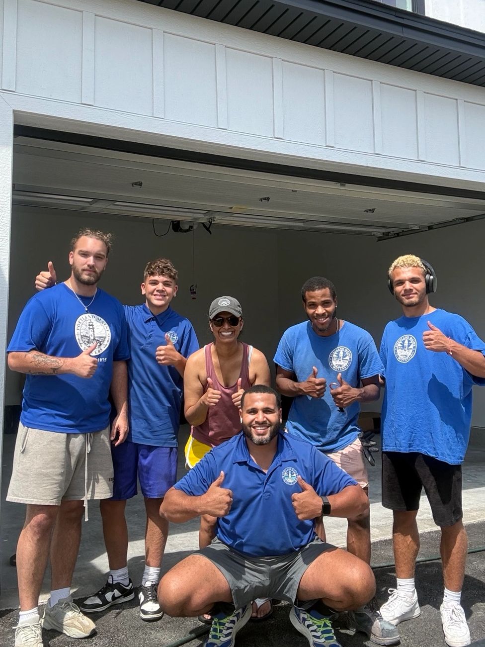 Portland Maine Movers crew and customer outside a home