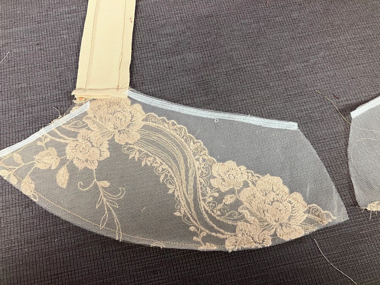 emboidered tulle lace lined with sheer cup lining. (wrong side showing)