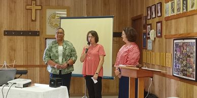Capitol District Fall Board depicting  Juanice, President Amy McDaniel with Lucy Wiggins from Frankl