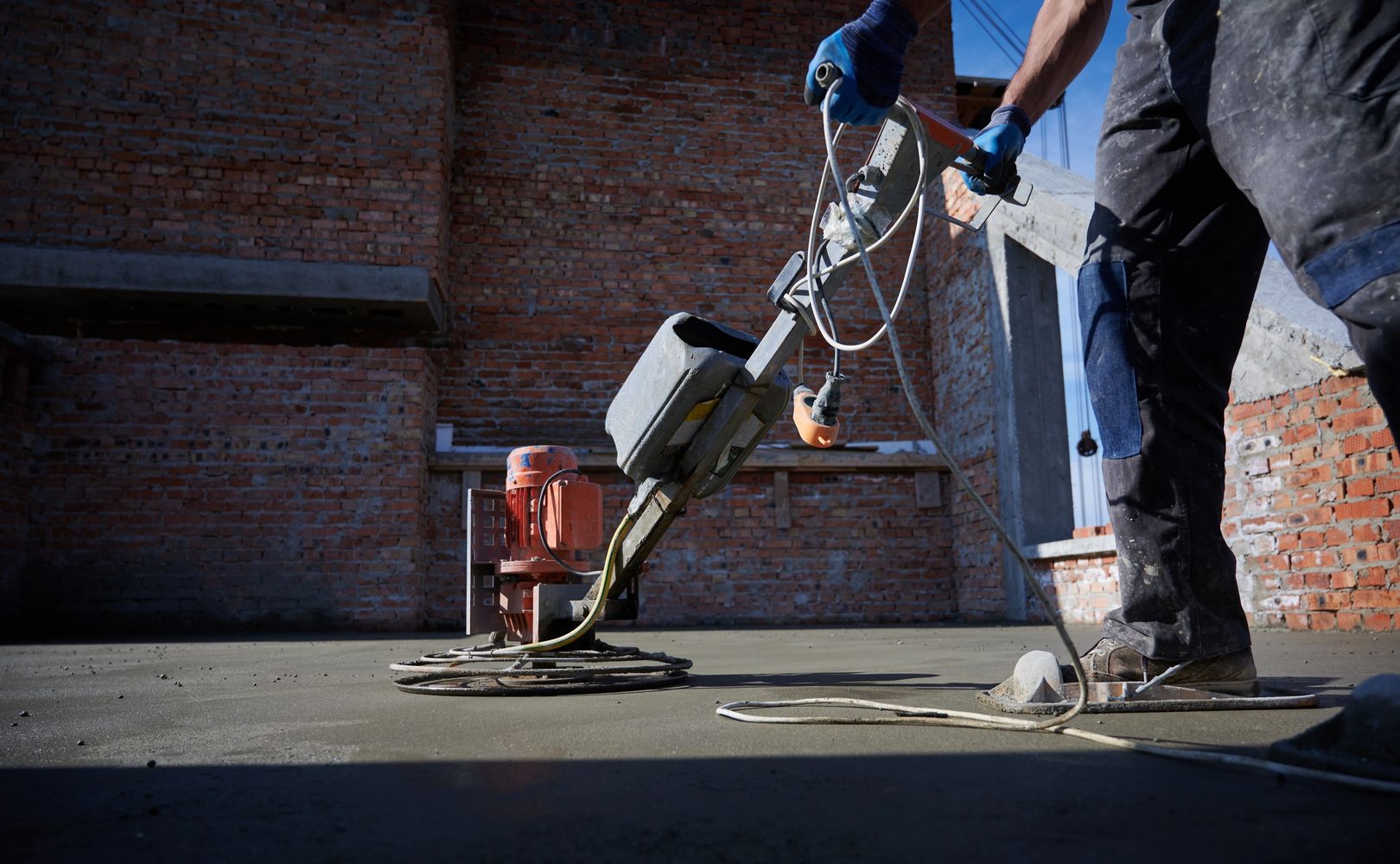 man working on concrete floor