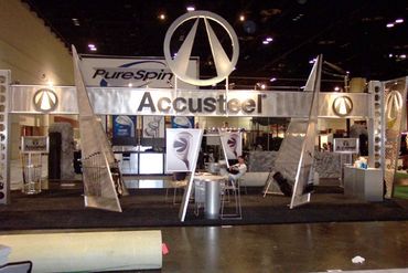 Trade show booth for Accusteel with modern design and branding.