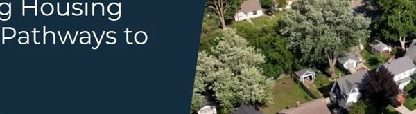 Aerial view of a neighborhood with the text 'Achieving Housing Dreams: Pathways to Success'.