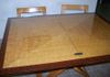 Originally a blonde maple, this table was painted to mimic satin wood with a mahogany border.