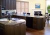 Previously honey colored cabinets get a dark bold look.