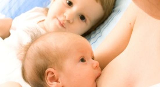 Breast Feeding Baby with Mom and  Toddler Sibling