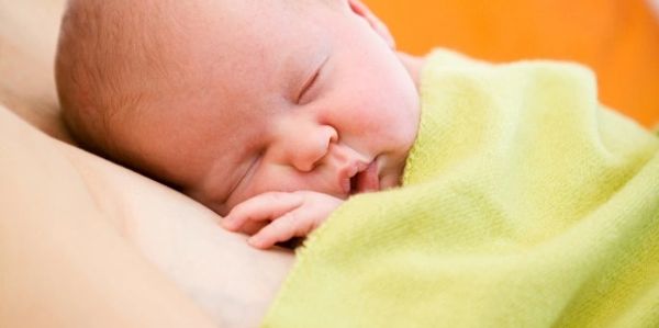 Sleeping Baby skin to skin on Mom's breast