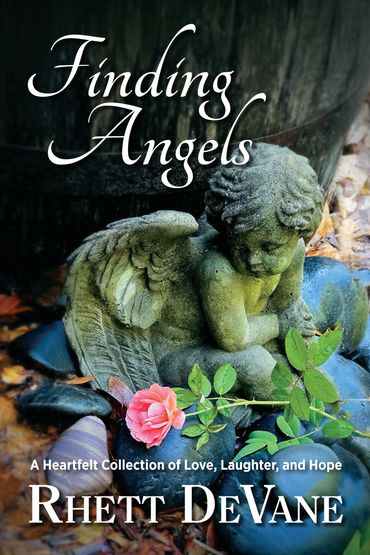 A stone angel statue with a pink rose, symbolizing love and hope.