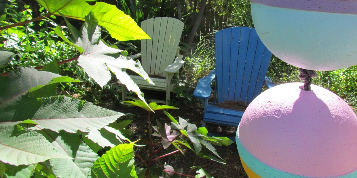 It's not a porch, but a lovely shaded spot. A tall glass of iced tea is bound to be on its way.