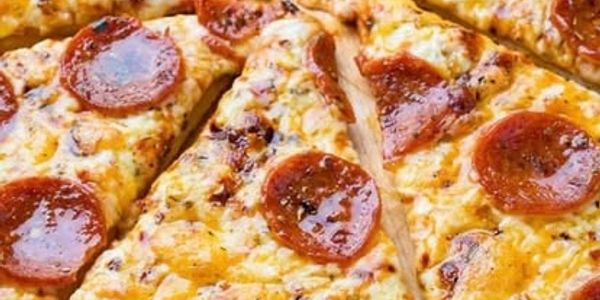 Pepperoni pizza slices with melted cheese.