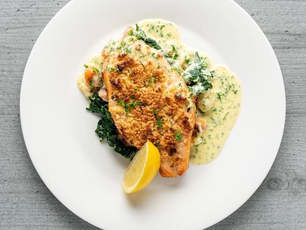 Fillet of salmon, almond crust and white wine butter sauce.