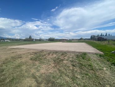 Excavating a pad for a new garage.