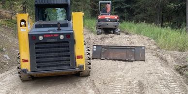 We used a mini-excavator and skid stir to finish grade a pad for a shop. 