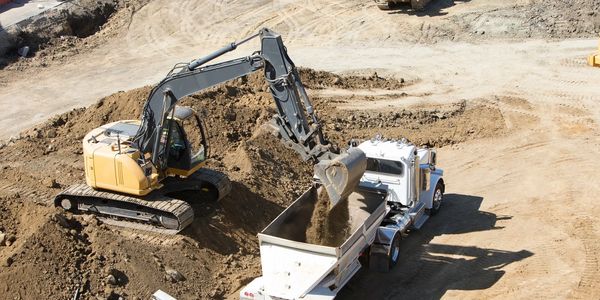 fill dirt being loaded from and excavation site