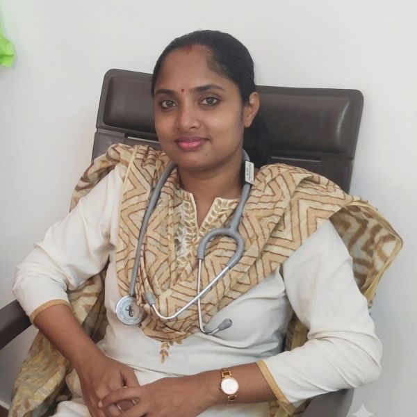 Young female doctor with a stethoscope sitting on a chair.