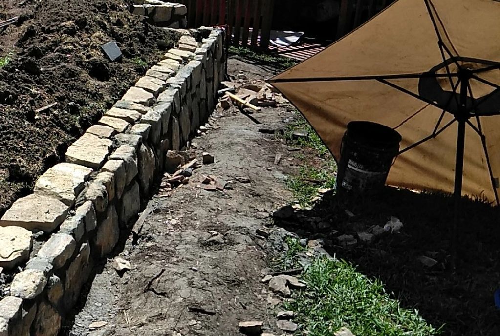 Retaining wall rebuilt with natural sandstone