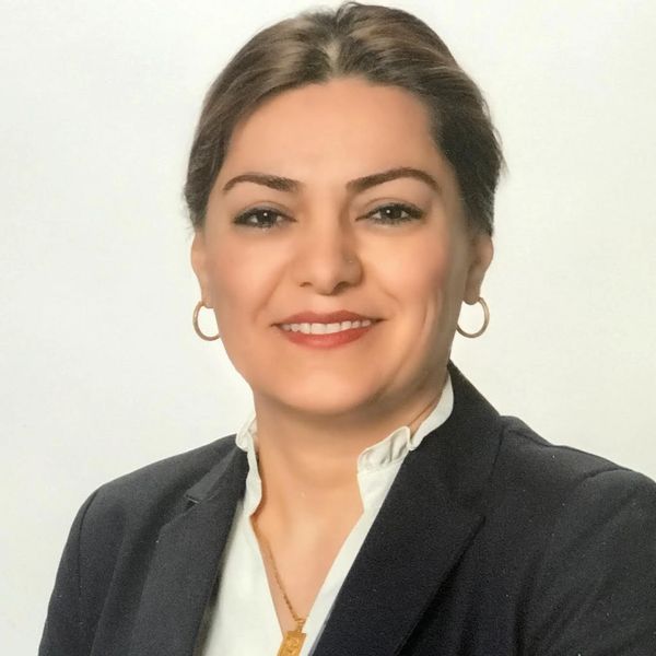 Professional woman smiling in a business portrait.