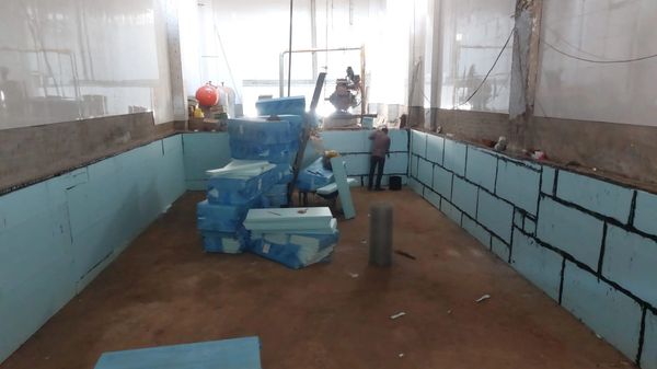 Indoor construction site with insulation foam boards.