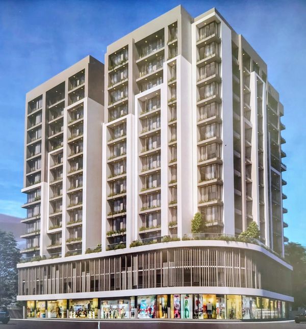 Modern multi-story commercial and residential building at dusk.