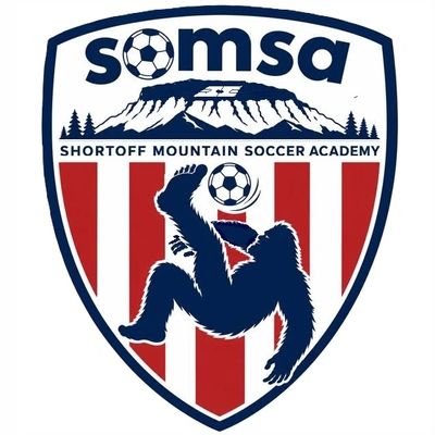 Logo of Shortoff Mountain Soccer Academy featuring a soccer-playing gorilla and mountain.