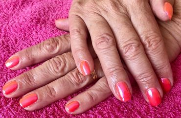 Chrome orange Gelish nails 