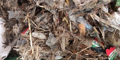 Photographic evidence from the Gozo facility shows farm slurry solids in the fine-screen area, confi