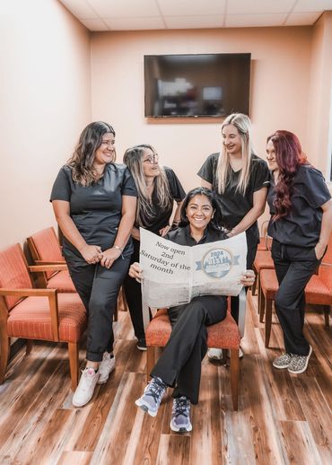 female family practice team members celebrating winning Best Nurse Practitioner in Polk County