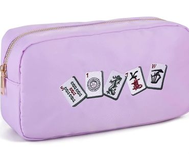 Lavender pouch with mahjong tile patches.