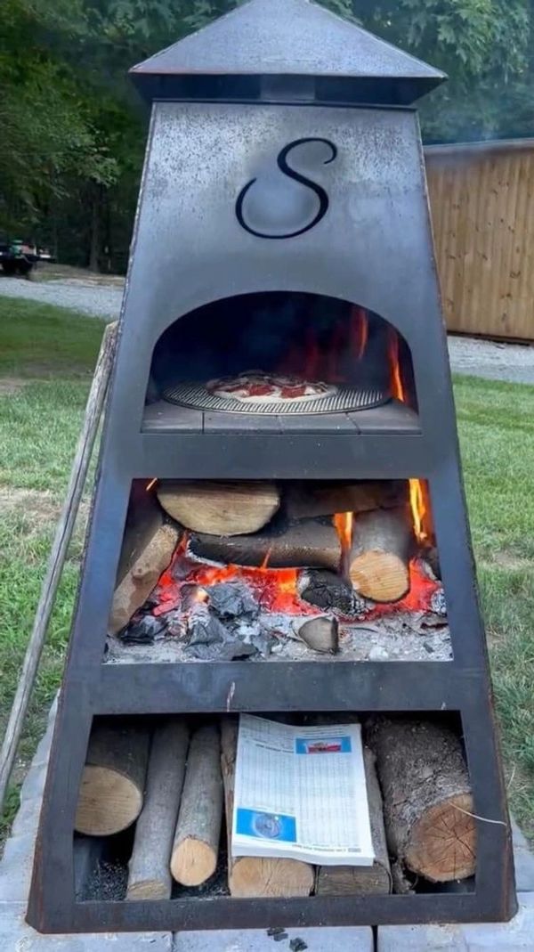 Heres The one Im Leaning towards...  Fire pit and Pizza over...