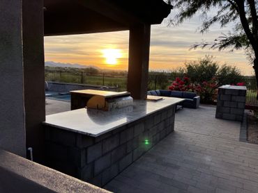 OUTDOOR KITCHEN AND PATIO AREA WITH SPA AND FIREPLACE 