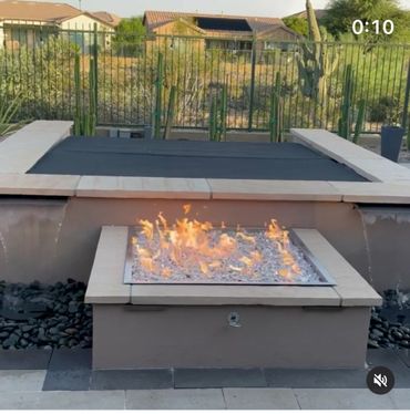 OUTDOOR WATER FEATURES WITH FIREPIT AND SPA AREA. 
